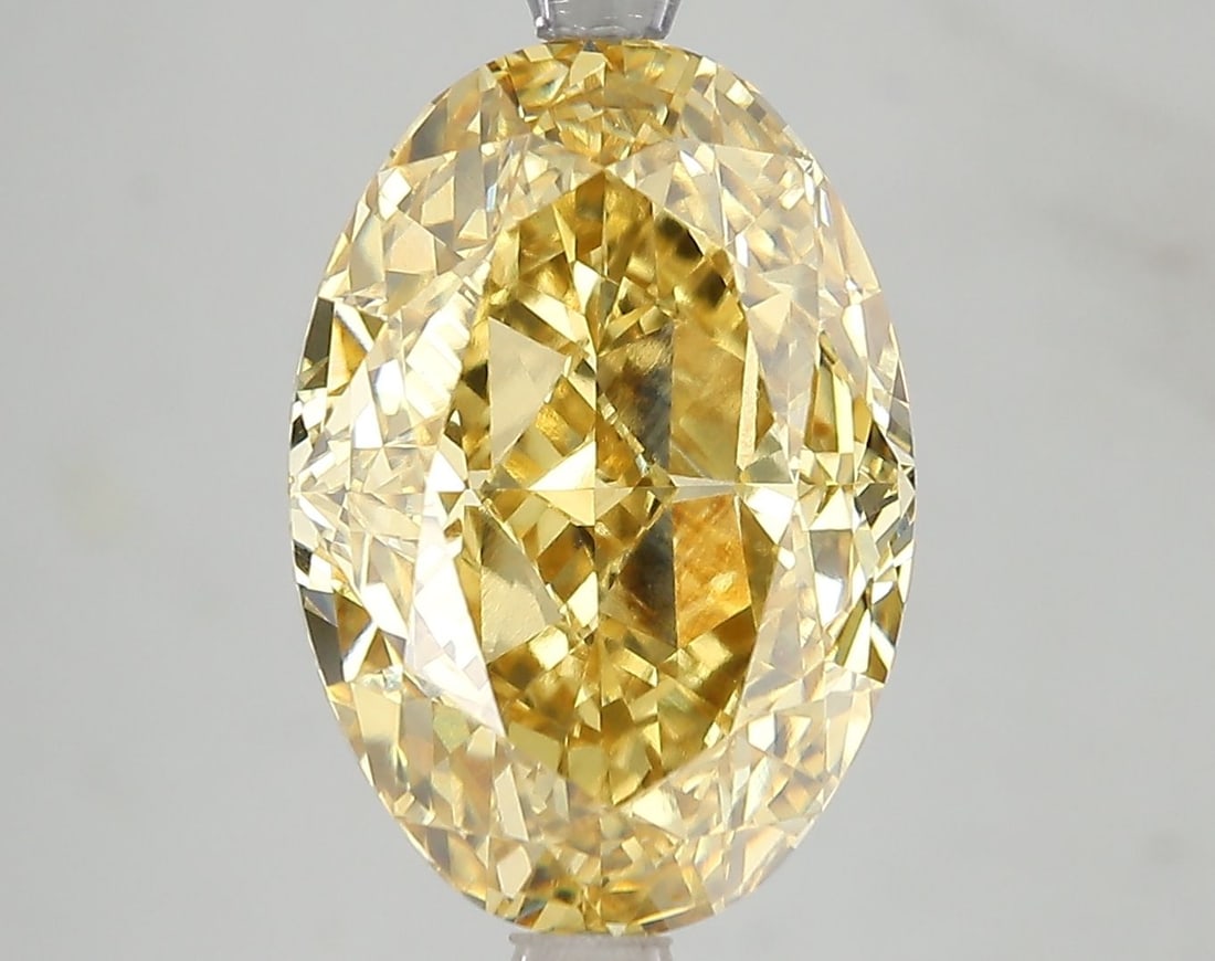 Loose Diamond - OVAL 7.25ct Fancy Vivid Yellow VS1: Loose Diamond - OVAL 7.25ct Fancy Vivid Yellow VS1 Source: This is a real non-mined Diamond that has been grown in a lab Shape: OVAL Carats: 7.25 Color: Fancy Vivid Yellow Certification: IGI Video: