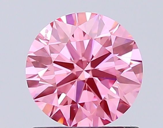Ideal Loose Diamond - ROUND 1.01ct Fancy Vivid Pink VS1: Ideal Loose Diamond - ROUND 1.01ct Fancy Vivid Pink VS1 Source: This is a real non-mined Diamond that has been grown in a lab Shape: ROUND Carats: 1.01 Color: Fancy Vivid Pink Certification: IGI Video