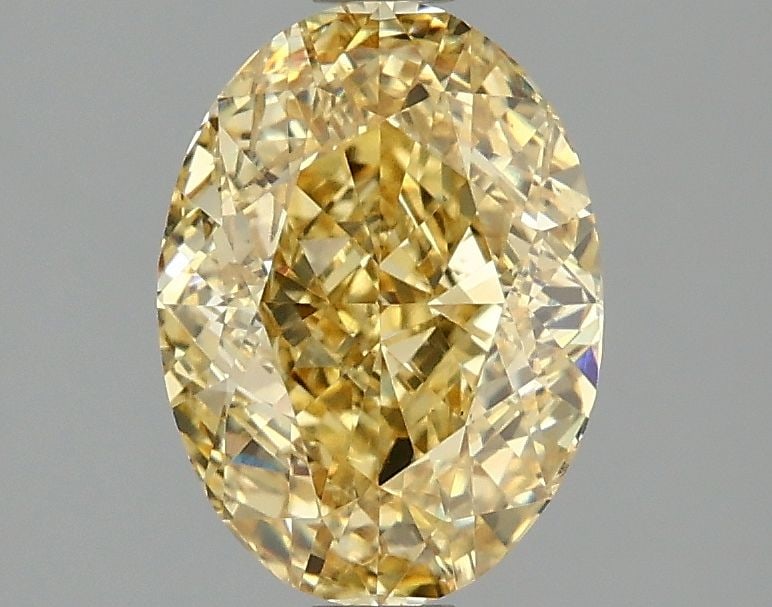 Loose Diamond - OVAL 2.07ct Fancy Vivid Yellow VS2: Loose Diamond - OVAL 2.07ct Fancy Vivid Yellow VS2 Source: This is a real non-mined Diamond that has been grown in a lab Shape: OVAL Carats: 2.07 Color: Fancy Vivid Yellow Certification: IGI Video: