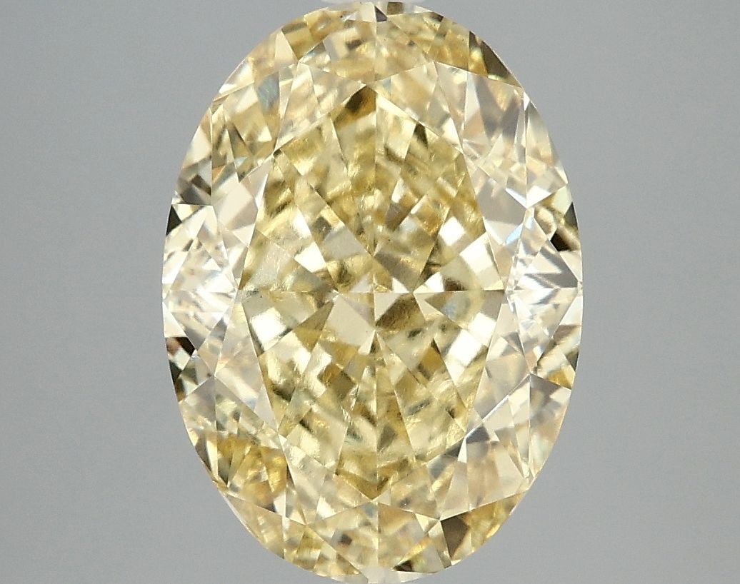Loose Diamond - OVAL 5.06ct Fancy Vivid Yellow VVS2: Loose Diamond - OVAL 5.06ct Fancy Vivid Yellow VVS2 Source: This is a real non-mined Diamond that has been grown in a lab Shape: OVAL Carats: 5.06 Color: Fancy Vivid Yellow Certification: IGI Video: