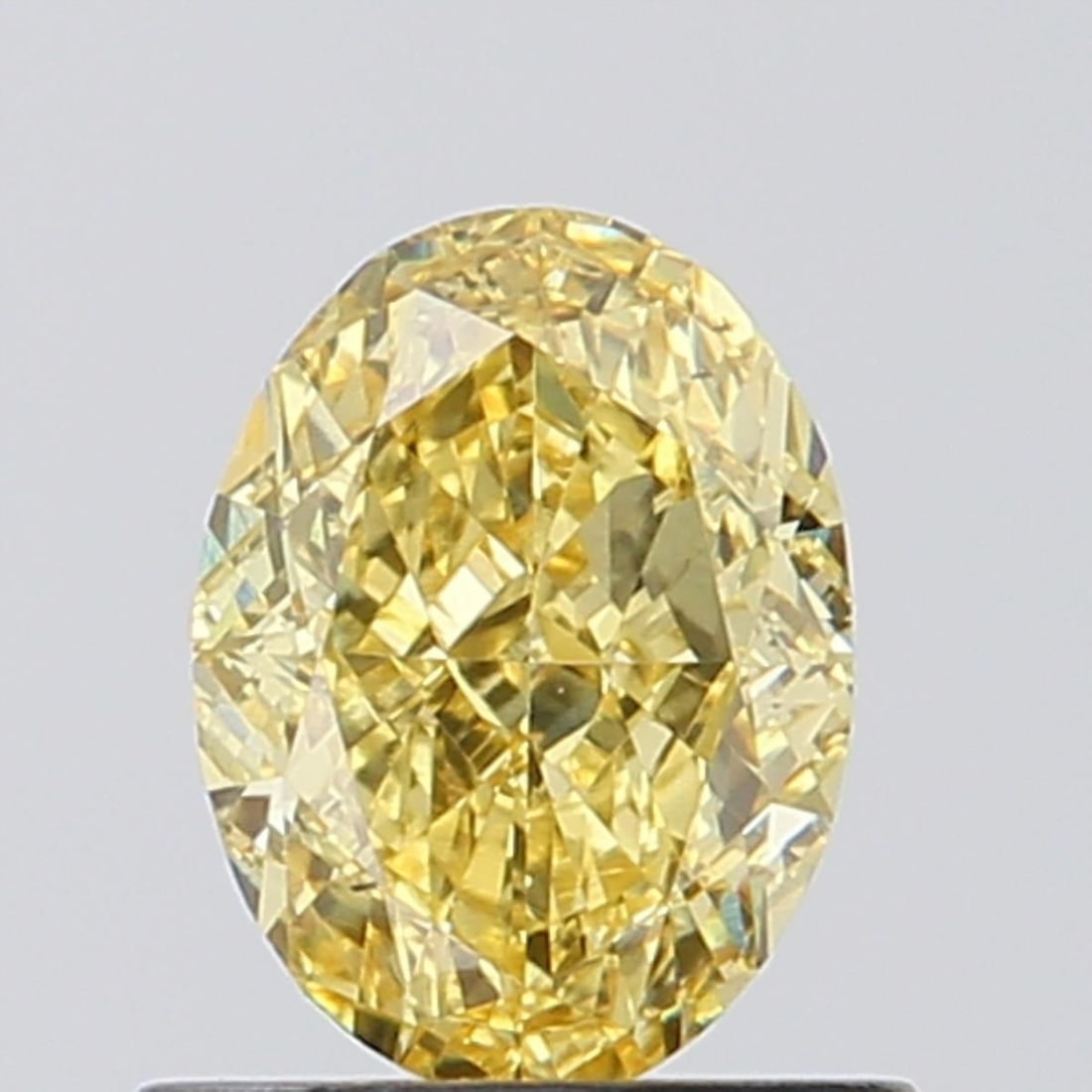 Loose Diamond - OVAL 0.93ct Fancy Vivid Yellow VS2: Loose Diamond - OVAL 0.93ct Fancy Vivid Yellow VS2 Source: This is a real non-mined Diamond that has been grown in a lab Shape: OVAL Carats: 0.93 Color: Fancy Vivid Yellow Certification: NONE Video: