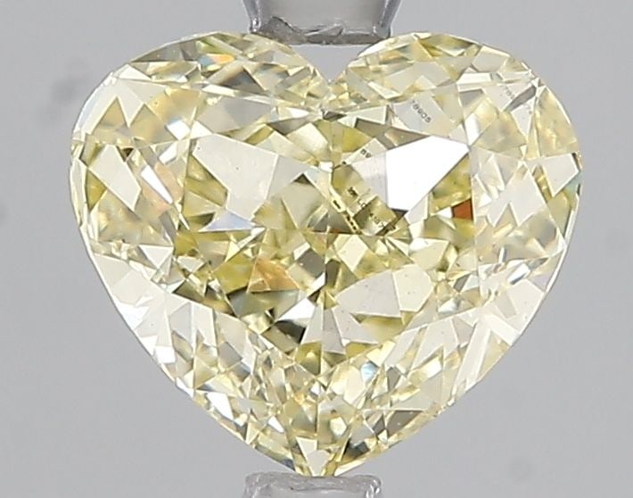 Loose Diamond - HEART 2.01ct Fancy Yellow VS1: Loose Diamond - HEART 2.01ct Fancy Yellow VS1 Source: This is a real non-mined Diamond that has been grown in a lab Shape: HEART Carats: 2.01 Color: Fancy Yellow Certification: IGI Video: