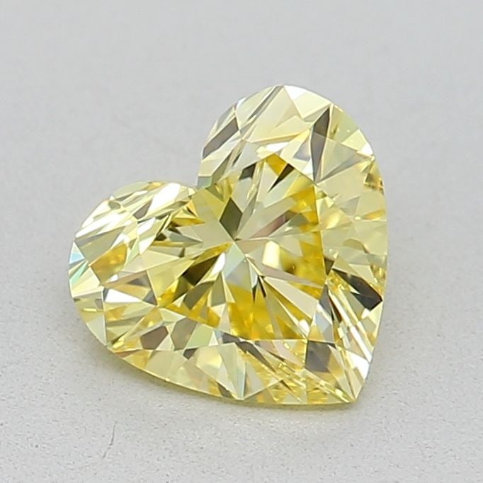 Loose Diamond - HEART 0.71ct Fancy Vivid Yellow VVS2: Loose Diamond - HEART 0.71ct Fancy Vivid Yellow VVS2 Source: This is a real non-mined Diamond that has been grown in a lab Shape: HEART Carats: 0.71 Color: Fancy Vivid Yellow Certification: IGI Video: