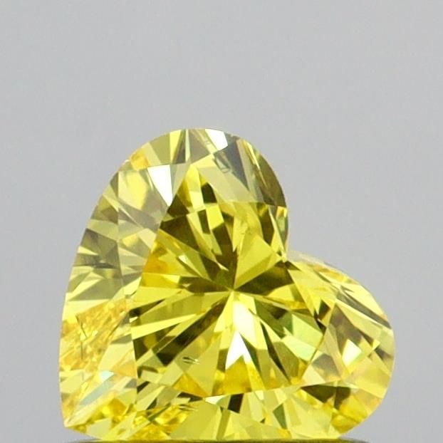 Loose Diamond - HEART 0.61ct Fancy Vivid Yellow SI1: Loose Diamond - HEART 0.61ct Fancy Vivid Yellow SI1 Source: This is a real non-mined Diamond that has been grown in a lab Shape: HEART Carats: 0.61 Color: Fancy Vivid Yellow Certification: IGI Video: