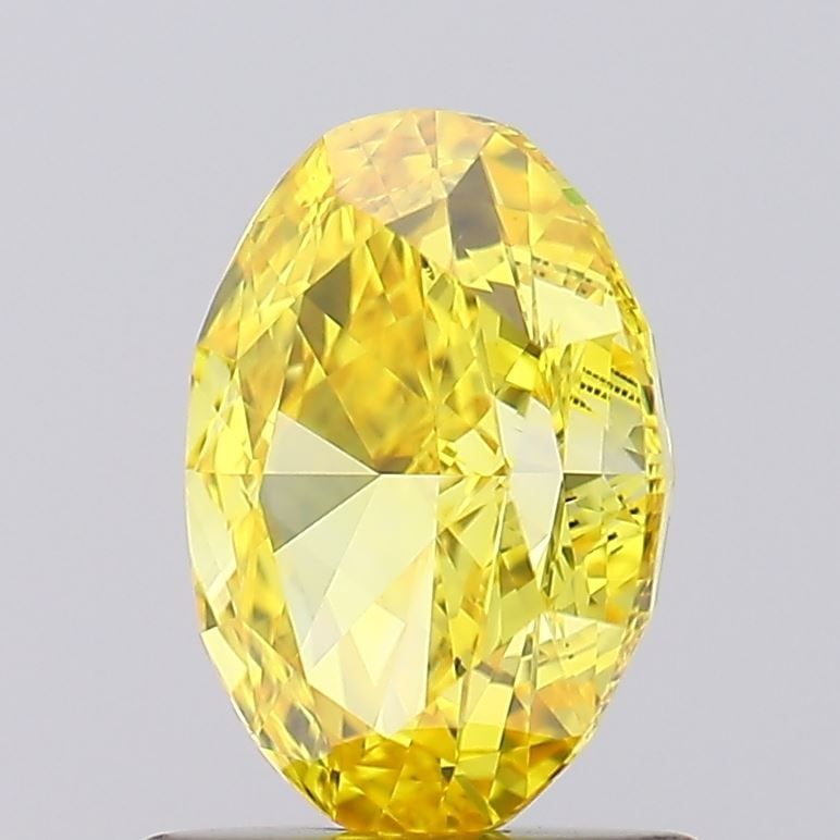 Loose Diamond - OVAL 1.01ct Fancy Vivid Yellow VS1: Loose Diamond - OVAL 1.01ct Fancy Vivid Yellow VS1 Source: This is a real non-mined Diamond that has been grown in a lab Shape: OVAL Carats: 1.01 Color: Fancy Vivid Yellow Certification: IGI Video: