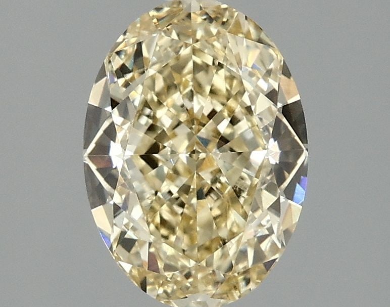 Loose Diamond - OVAL 2.1ct Fancy Vivid Yellow VVS2: Loose Diamond - OVAL 2.1ct Fancy Vivid Yellow VVS2 Source: This is a real non-mined Diamond that has been grown in a lab Shape: OVAL Carats: 2.1 Color: Fancy Vivid Yellow Certification: IGI Video: