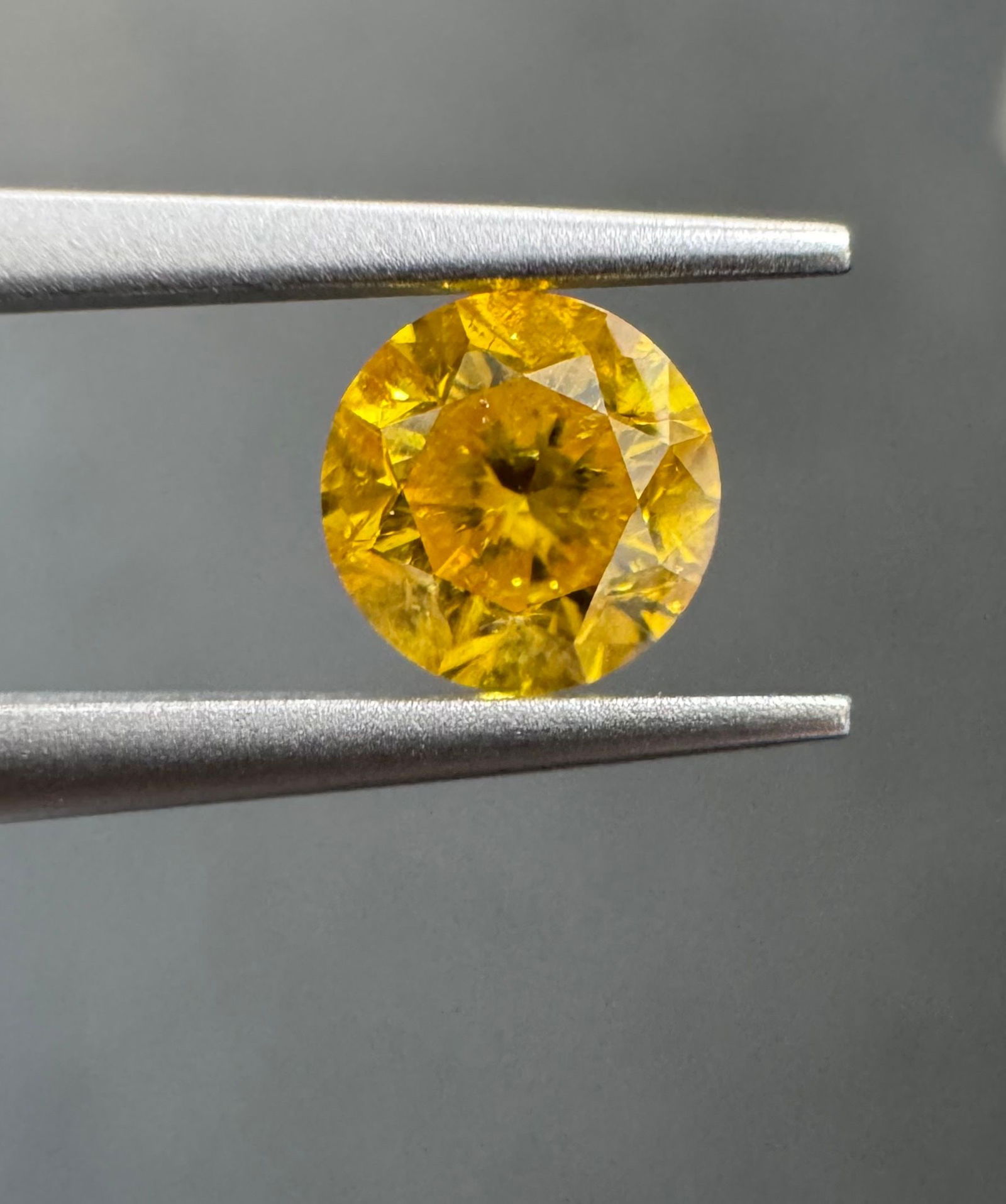 Loose Diamond - ROUND 0.68ct Fancy Vivid Orangey Yellow I3: Loose Diamond - ROUND 0.68ct Fancy Vivid Orangey Yellow I3 Source: Natural Shape: ROUND Carats: 0.68 Color: Fancy Vivid Orangey Yellow Certification: GIA PLEASE NOTE: Framed, Large, or heavy items do