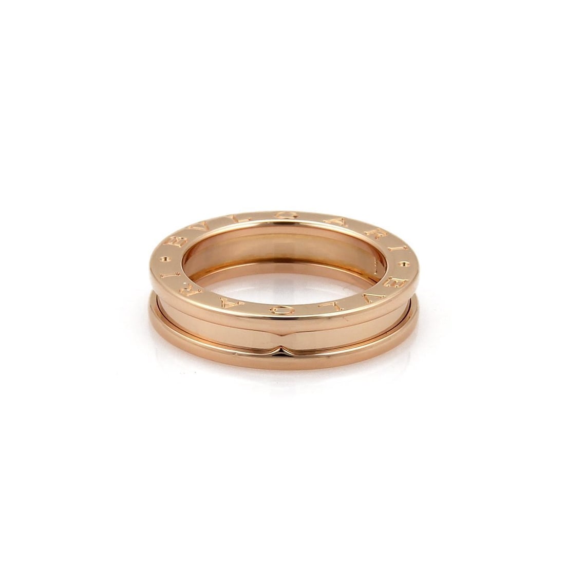 Bvlgari B Zero 1 18k Rose Gold 5mm Band Ring Size 50: Bvlgari B Zero 1 18k Rose Gold 5mm Band Ring Size 50 This stunning band ring from Bvlgari's B Zero 1 collection is crafted from luxurious 18k rose gold and features a sleek polished finish. The design