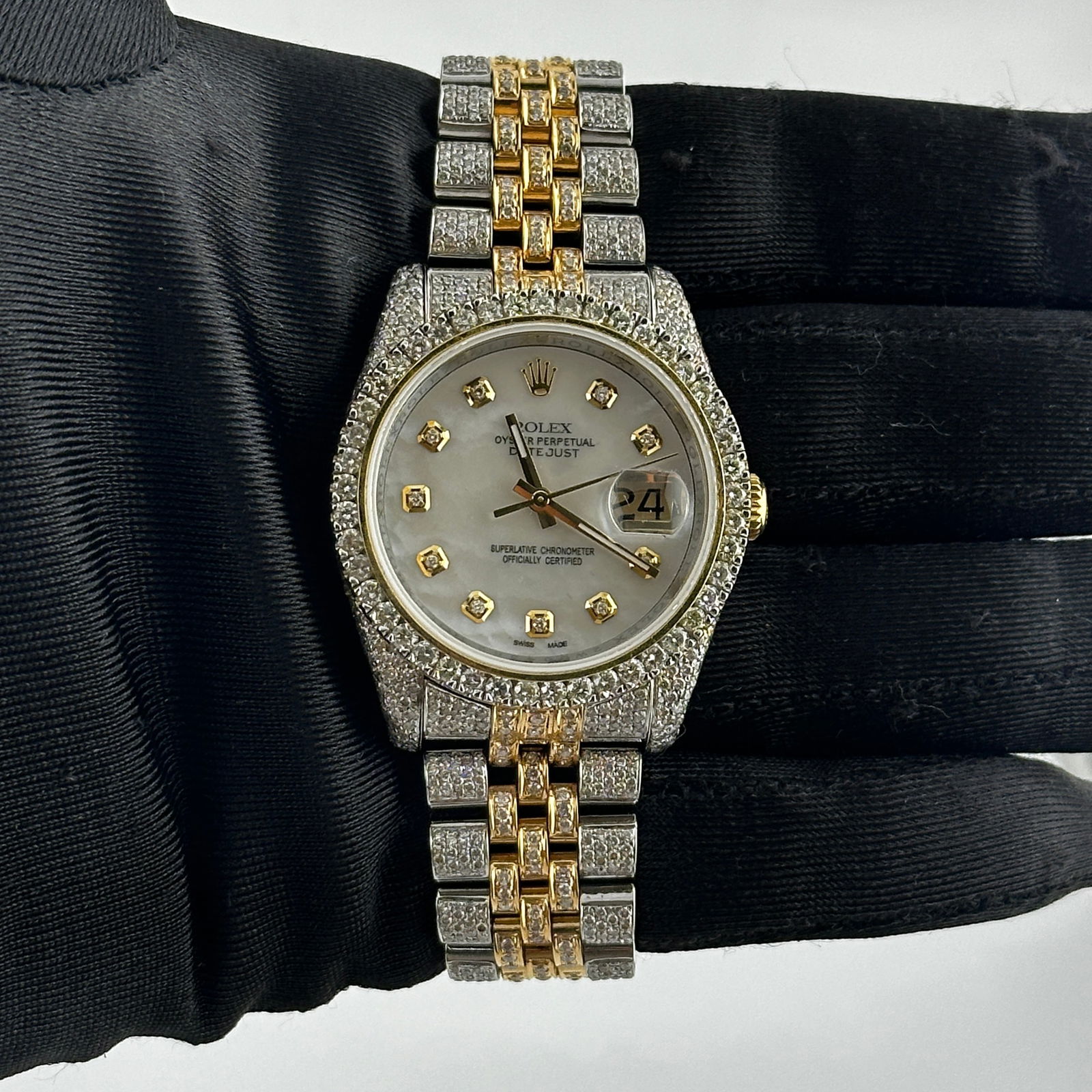 Rolex Datejust 116233 Men's Watch Aftermarket White Mother of Pearl Dial Diamond Bezel: Rolex Datejust 116233 Men's Watch Aftermarket White Mother of Pearl Dial Diamond Bezel This Rolex Datejust men's watch features a white mother-of-pearl dial and a diamond prong bezel. It is fitted wit