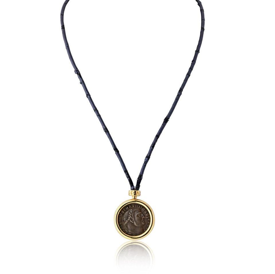 18K Yellow Gold Bvlgari Coin Pendant Necklace with Leather Cord and Rondelles: 18K Yellow Gold Bvlgari Coin Pendant Necklace with Leather Cord and Rondelles This Bvlgari pendant features a classic 18K yellow gold coin design, suspended on a leather cord and accented with Bvlgari
