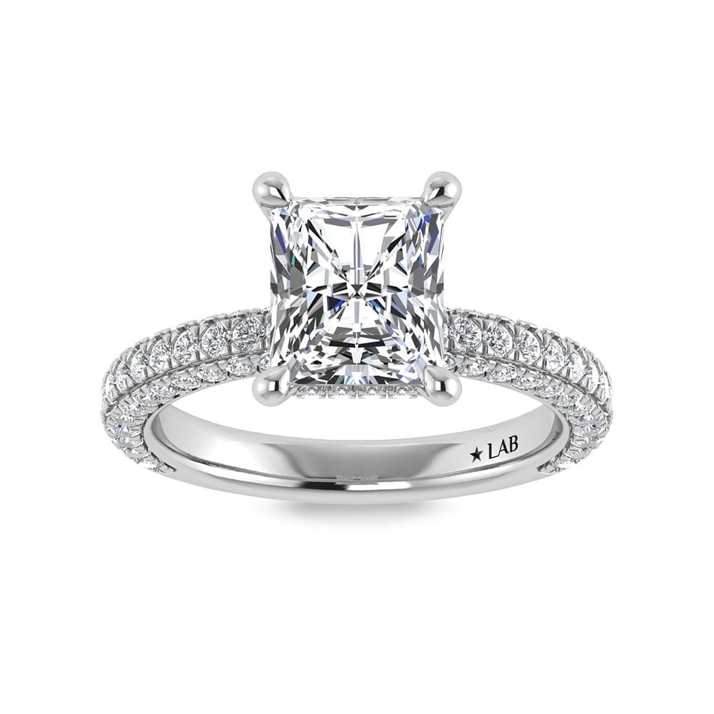 14K White Gold Lab Grown Diamond 4 Ct.Tw. Radiant Shape Halo Engagement Ring (IGI Certified Center: 14K White Gold Lab Grown Diamond 4 Ct.Tw. Radiant Shape Halo Engagement Ring (IGI Certified Center 3ct) Discover subtle brilliance and modern elegance with our Hidden Halo Diamond Engagement Ring. Thi