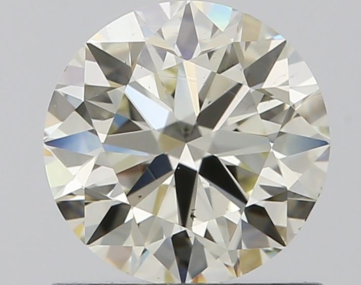 Loose Diamond - ROUND 0.9ct J VS1: Loose Diamond - ROUND 0.9ct J VS1 Source: Natural Shape: ROUND Carats: 0.9 Color: J Clarity: VS1 Certification: IGI Video: