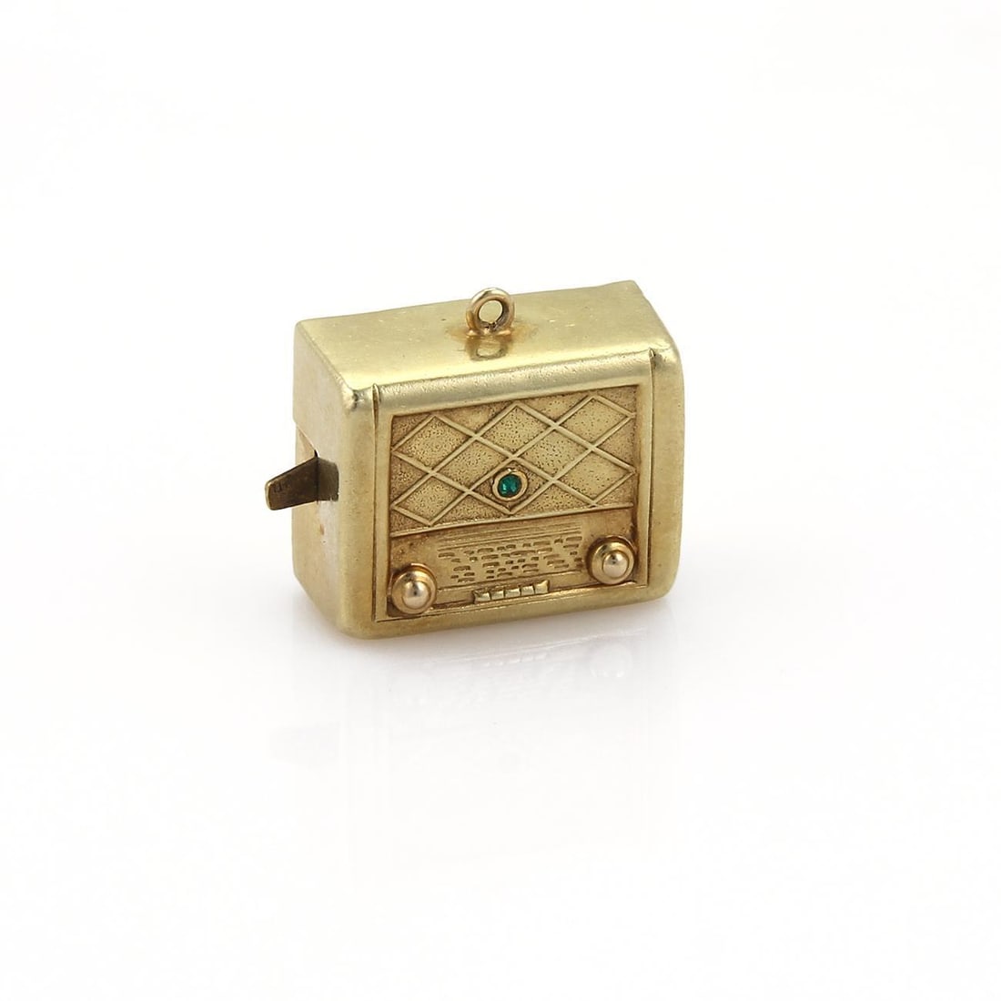 Vintage 14k Yellow Gold Music Box Charm with Emerald Gemstone: Vintage 14k Yellow Gold Music Box Charm with Emerald Gemstone This charming vintage music box pendant is expertly crafted from 14k yellow gold. It features a detailed design resembling a music radio b