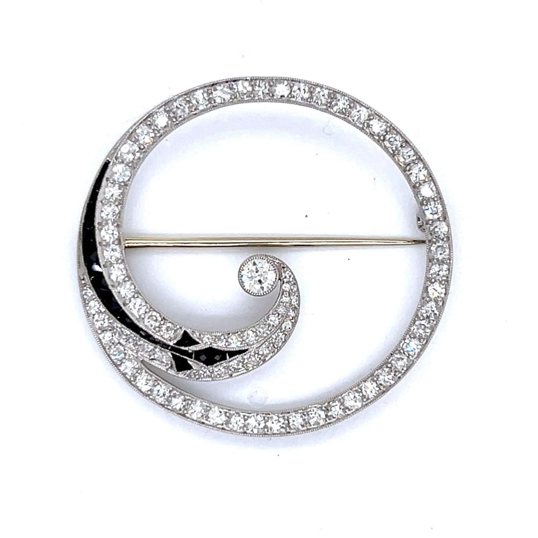 Art Deco Platinum Brooch with 83 Diamonds and Onyx 1.5 inches: Art Deco Platinum Brooch with 83 Diamonds and Onyx 1.5 inches This stunning Art Deco brooch is crafted from platinum and features a striking combination of diamonds and onyx. Weighing 8.3 grams, the b