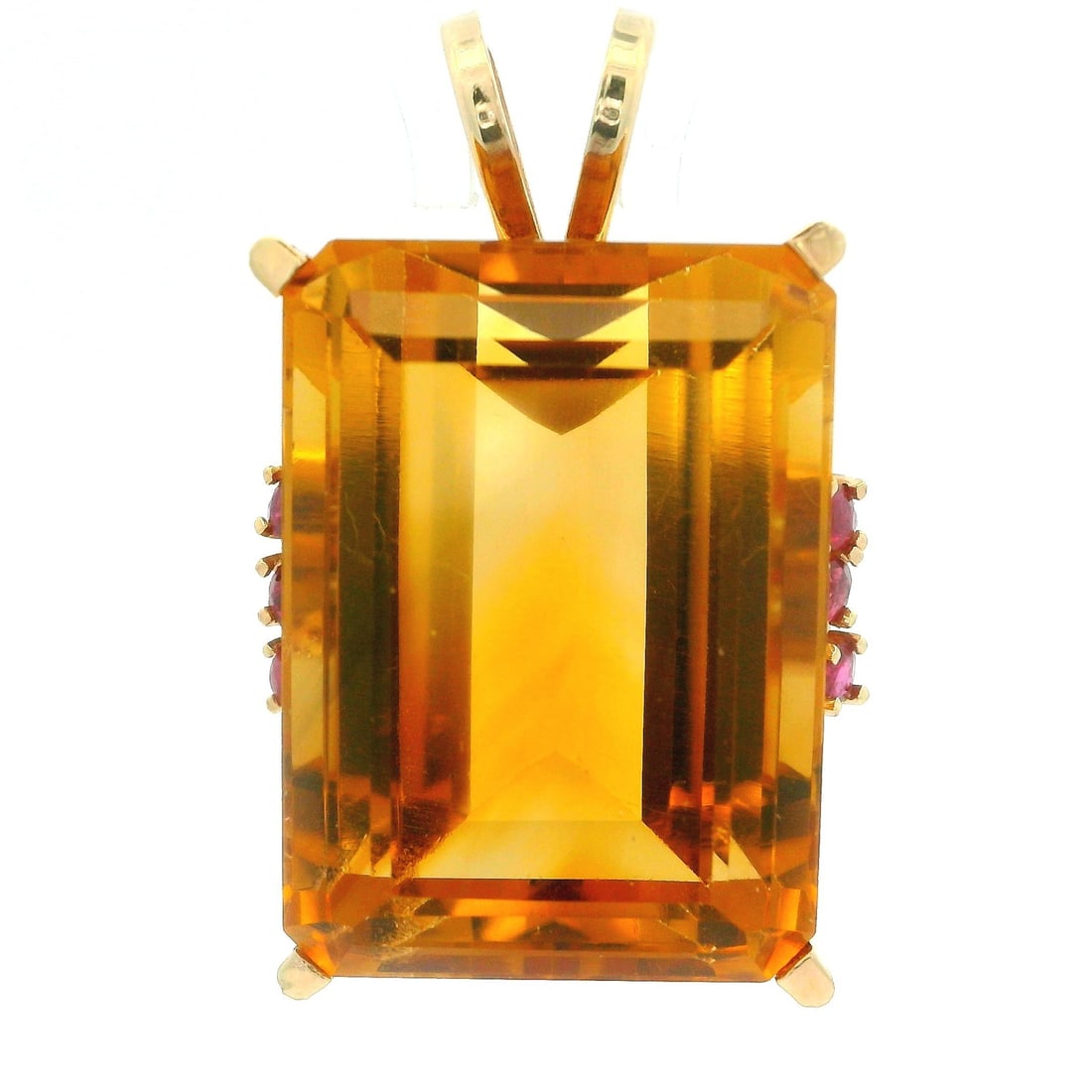 Vintage 14k Rosy Yellow Gold Citrine Ruby Pendant Necklace: Vintage 14k Rosy Yellow Gold Citrine Ruby Pendant Necklace This stunning vintage retro pendant showcases a beautiful emerald cut natural citrine, measuring approximately 24.8x18mm, with a vibrant oran