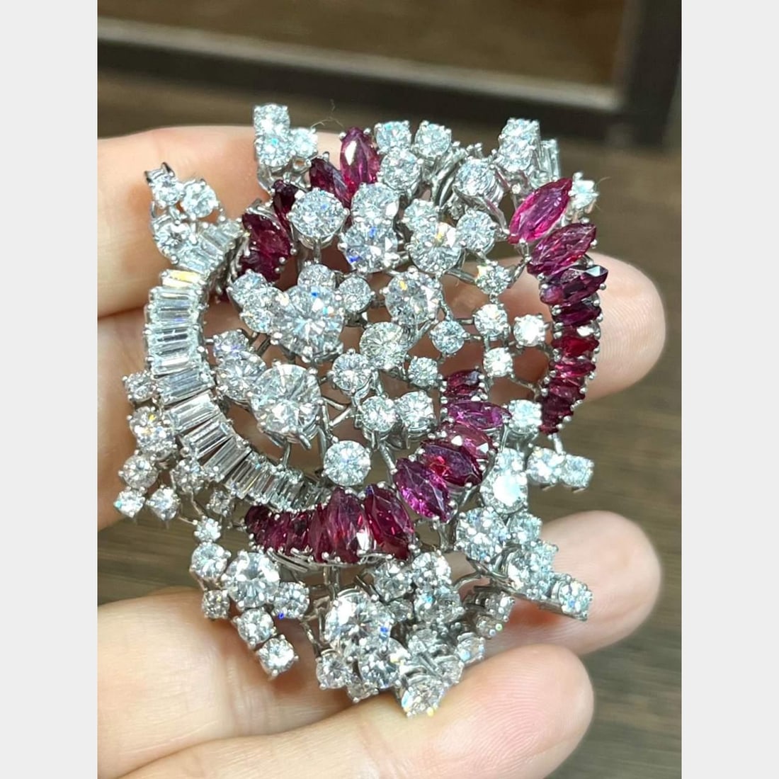 Vintage 1950's Platinum Diamond Ruby Brooch 20.00 Ct Diamonds 10.00 Ct Rubies: Vintage 1950's Platinum Diamond Ruby Brooch 20.00 Ct Diamonds 10.00 Ct Rubies This exquisite 1950's Platinum Brooch features a stunning arrangement of diamonds and rubies. Weighing 46.5 grams, it is a