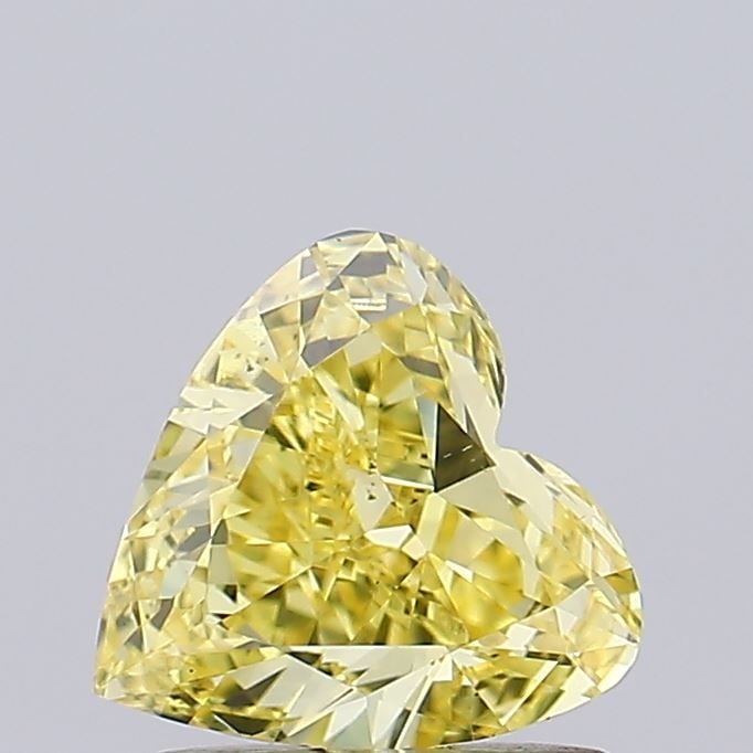 Loose Diamond - HEART 1.01ct Fancy Vivid Yellow VS2: Loose Diamond - HEART 1.01ct Fancy Vivid Yellow VS2 Source: This is a real non-mined Diamond that has been grown in a lab Shape: HEART Carats: 1.01 Color: Fancy Vivid Yellow Certification: IGI