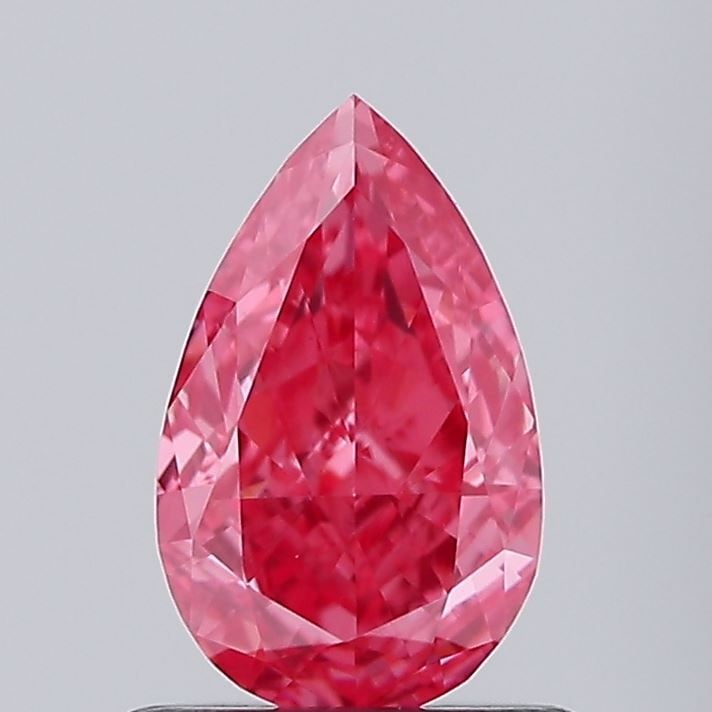 Loose Diamond - PEAR 0.71ct Fancy Vivid Pink VVS2: Loose Diamond - PEAR 0.71ct Fancy Vivid Pink VVS2 Source: This is a real non-mined Diamond that has been grown in a lab Shape: PEAR Carats: 0.71 Color: Fancy Vivid Pink Certification: IGI Video: