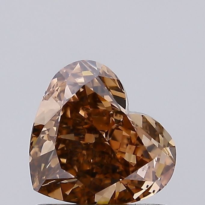 Loose Diamond - HEART 0.95ct Fancy Brown VVS2: Loose Diamond - HEART 0.95ct Fancy Brown VVS2 Source: This is a real non-mined Diamond that has been grown in a lab Shape: HEART Carats: 0.95 Color: Fancy Brown Certification: IGI Video: