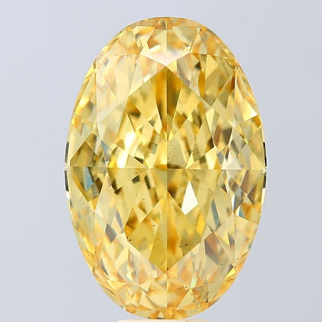 Loose Diamond - OVAL 12.05ct Fancy Vivid Yellow VS2: Loose Diamond - OVAL 12.05ct Fancy Vivid Yellow VS2 Source: This is a real non-mined Diamond that has been grown in a lab Shape: OVAL Carats: 12.05 Color: Fancy Vivid Yellow Certification: IGI Video:
