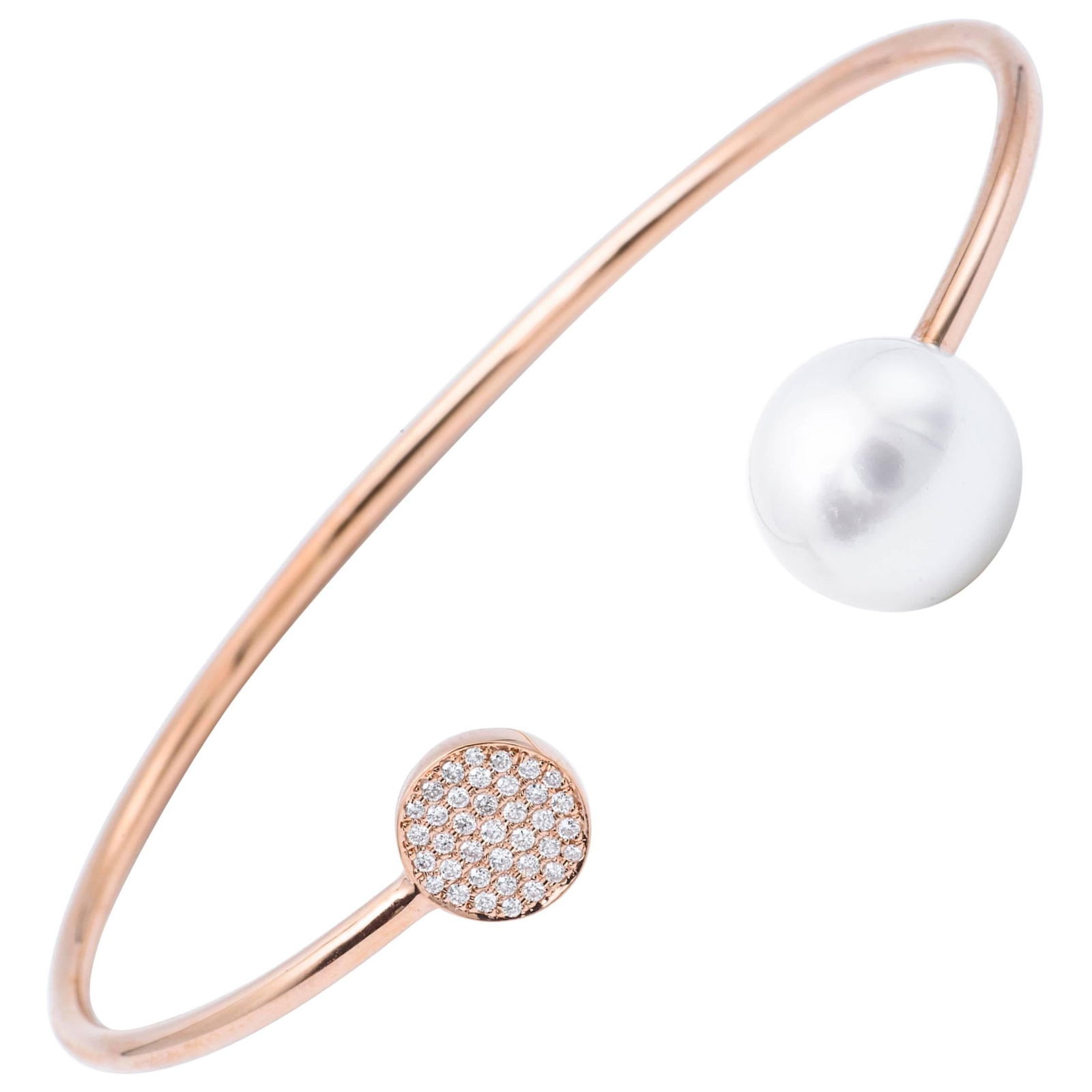 Harbor Diamonds 18K Rose Gold South Sea Pearl Diamond Bangle: Harbor Diamonds 18K Rose Gold South Sea Pearl Diamond Bangle This exquisite bangle features a stunning combination of 18k rose gold, a luxurious South Sea pearl, and sparkling diamonds. The centerpiec