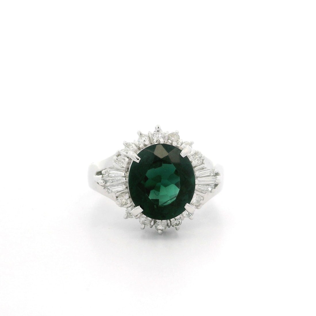 Platinum GIA 2.58ctw Dark Blue Green Tourmaline Diamond Cocktail Ring: Platinum GIA 2.58ctw Dark Blue Green Tourmaline Diamond Cocktail Ring This exquisite cocktail ring features a stunning natural oval cut dark blue-green tourmaline, weighing 2.34 carats, securely prong