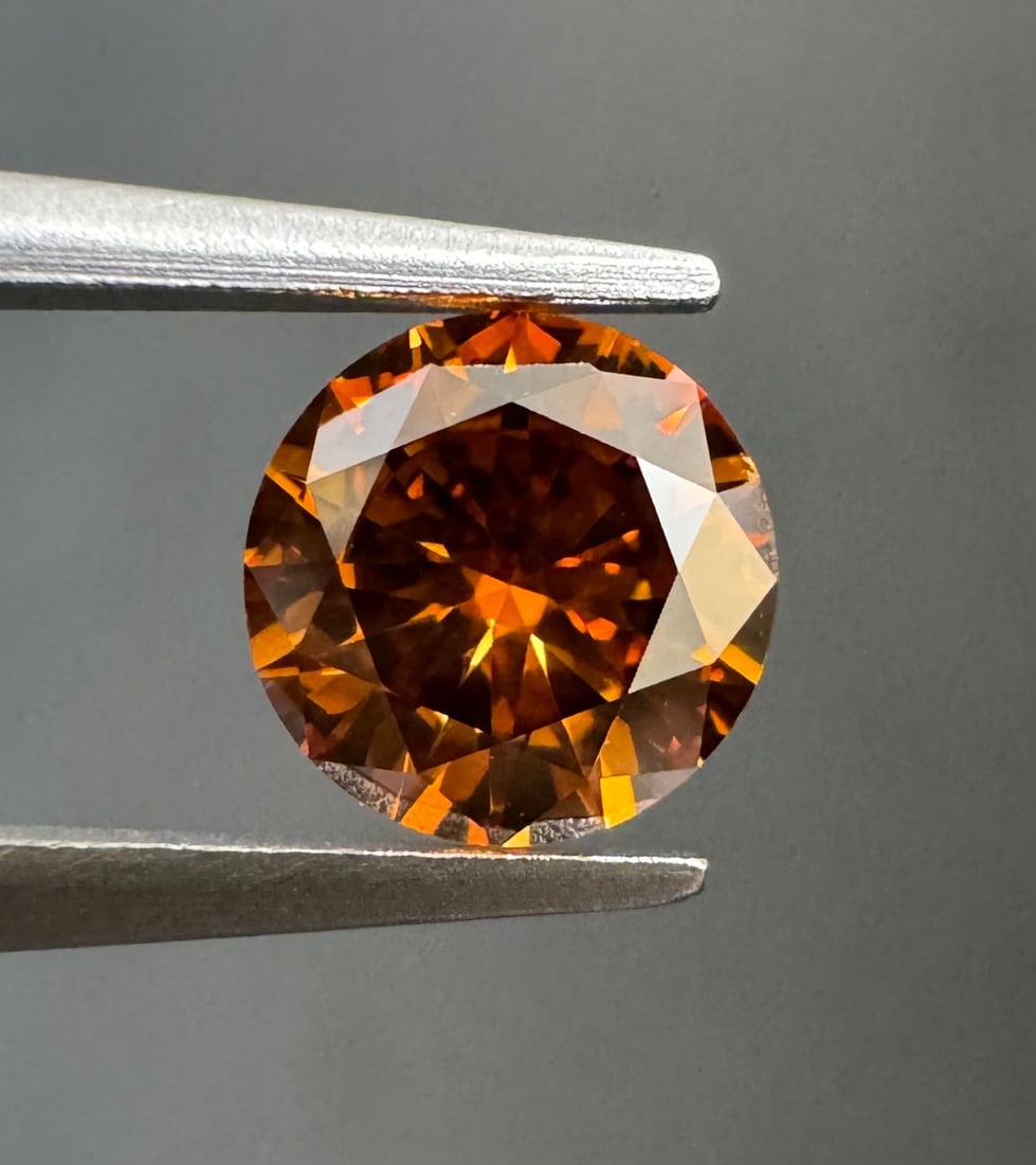 Loose Diamond - ROUND 0.51ct Fancy Deep Brownish Orange SI2: Loose Diamond - ROUND 0.51ct Fancy Deep Brownish Orange SI2 Source: Natural Shape: ROUND Carats: 0.51 Color: Fancy Deep Brownish Orange Certification: GIA PLEASE NOTE: Framed, Large, or heavy items do