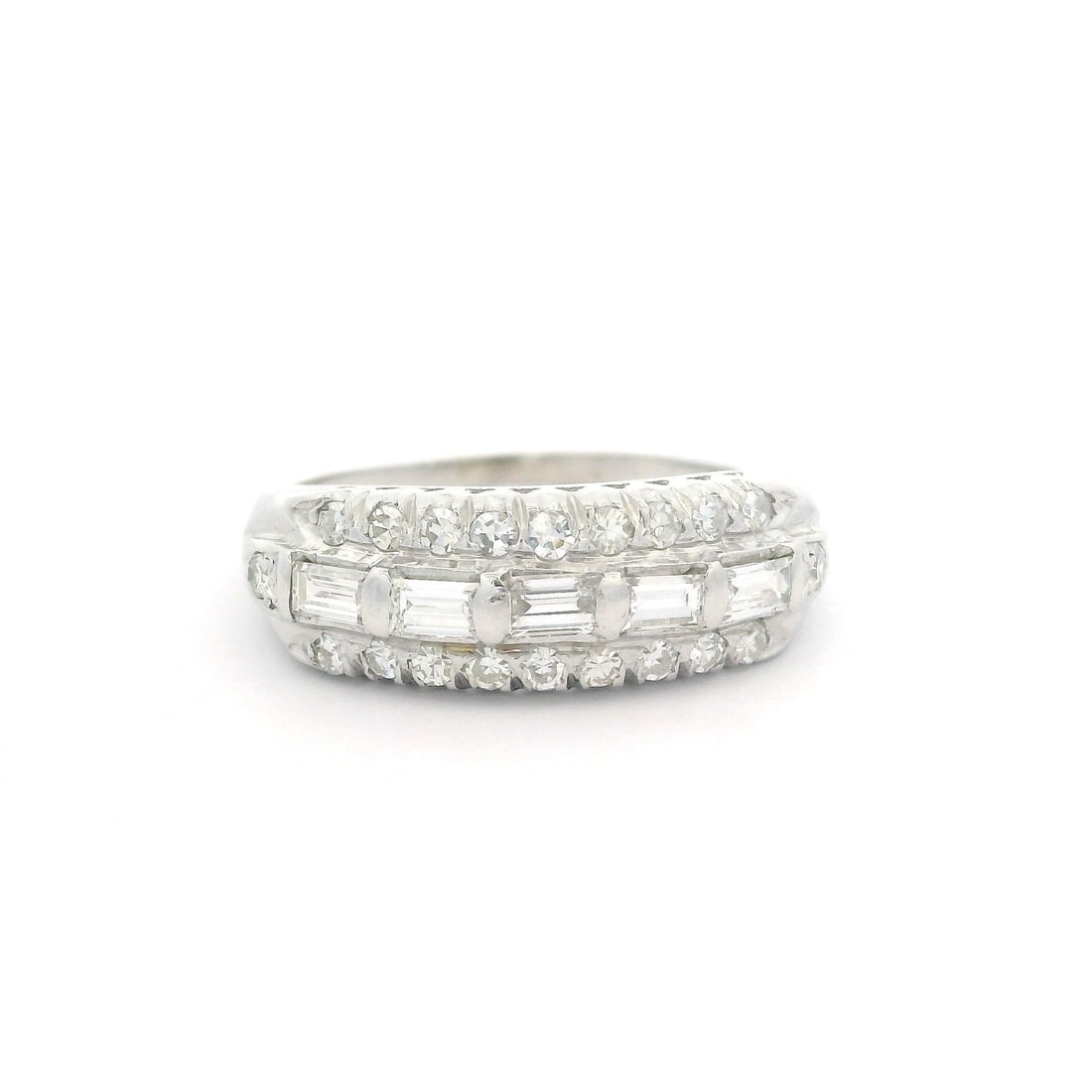 Vintage 14k White Gold 0.65ctw Baguette Diamond Band Ring: Vintage 14k White Gold 0.65ctw Baguette Diamond Band Ring This exquisite vintage band ring showcases a stunning arrangement of (25) natural genuine diamonds, combining 20 single cut and 5 straight bag