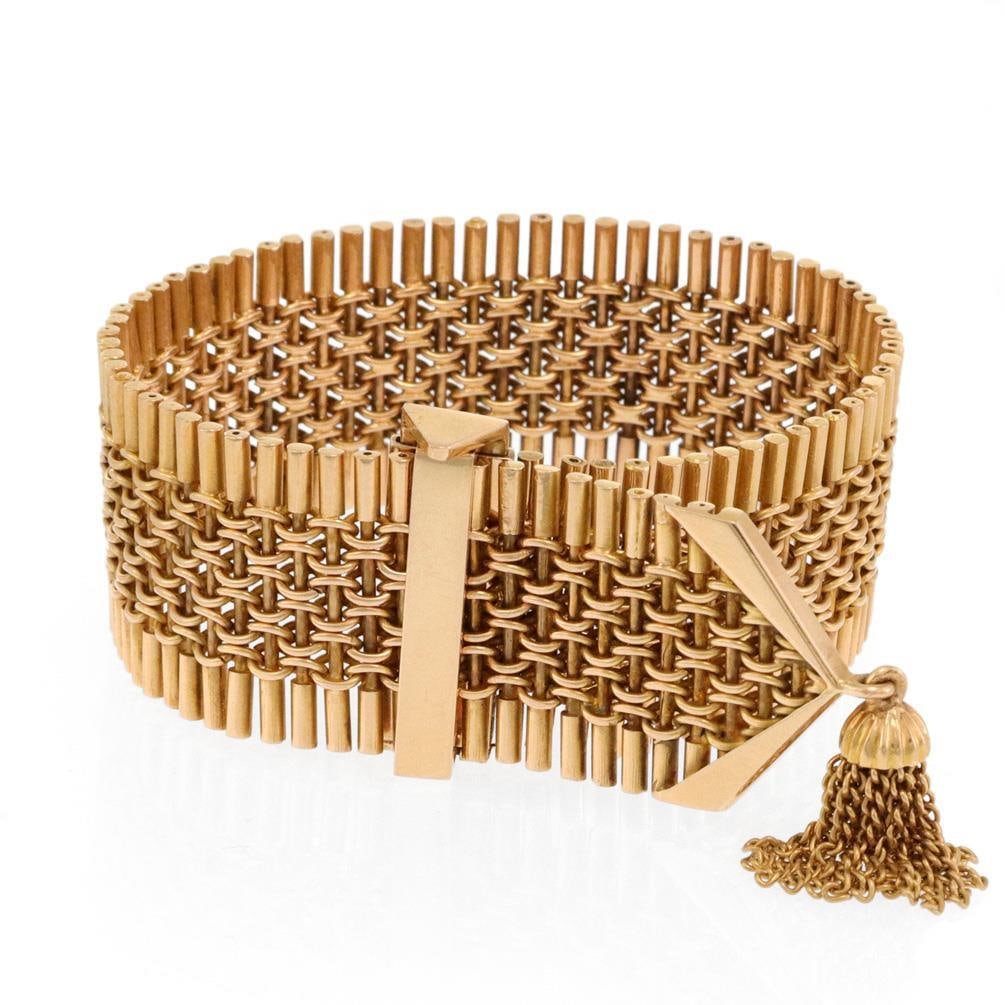 Vintage 18k Yellow Gold Pin Link Tassel Bracelet 24mm Wide: Vintage 18k Yellow Gold Pin Link Tassel Bracelet 24mm Wide This stunning vintage bracelet is expertly crafted from 18k yellow gold, showcasing a unique design with long stick links and a woven fancy c