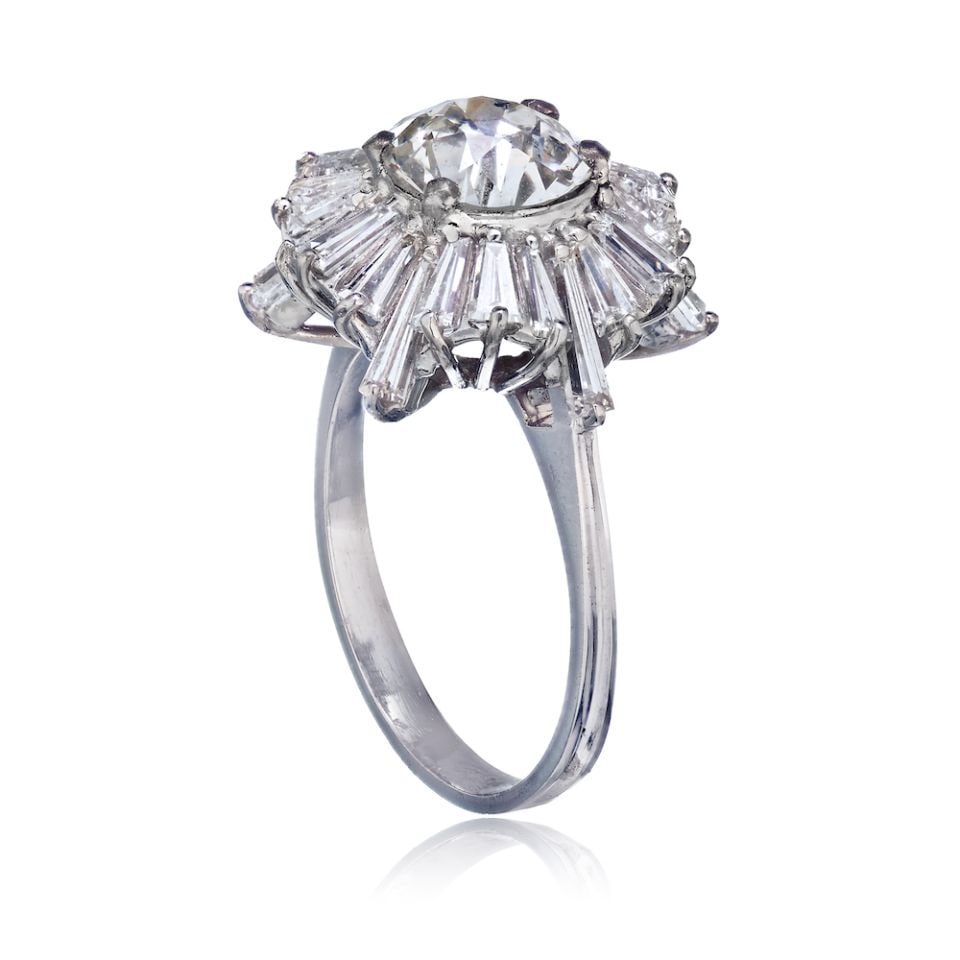 Platinum Baguette Engagement Ring 1.65 Cts Pre-Owned: Platinum Baguette Engagement Ring 1.65 Cts Pre-Owned This exquisite Baguette's Ring is crafted from high-quality platinum, weighing 6 grams. It features stunning baguette-cut diamonds, with an exact