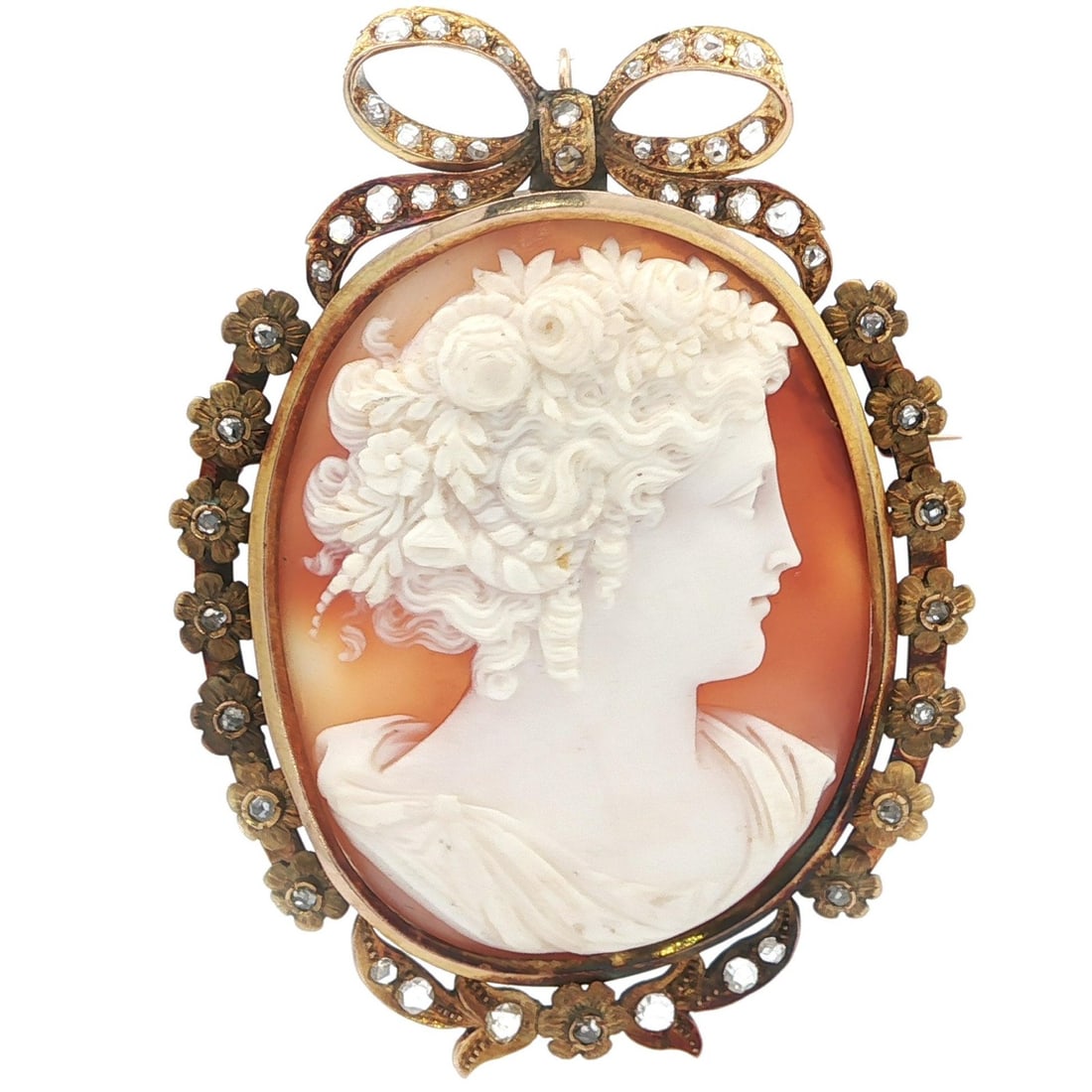 Antique Solid Gold Cameo Brooch with Rose Cut Diamonds: Antique Solid Gold Cameo Brooch with Rose Cut Diamonds This exquisite antique brooch pendant features a large carved shell cameo adorned with old rose cut diamonds. The oval-shaped shell showcases a b
