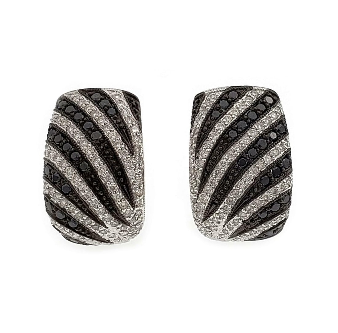 Zebra Style 14k White Gold Huggie Earrings with Black and White Diamonds: Zebra Style 14k White Gold Huggie Earrings with Black and White Diamonds Elevate your style with this stunning pair of modern huggie earrings, expertly crafted from 14k white gold. Showcasing a unique