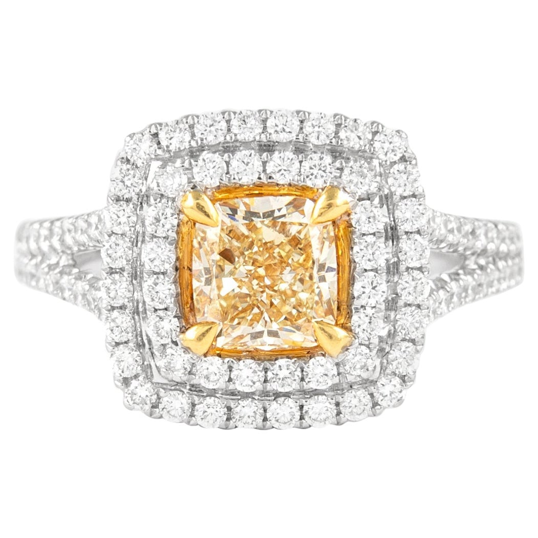 2.05ct Fancy Yellow Diamond Halo Ring 18k Two Tone EGL Certified: 2.05ct Fancy Yellow Diamond Halo Ring 18k Two Tone EGL Certified This exquisite 2.05ct Fancy Yellow VS1 Diamond Halo Ring features a stunning cushion cut fancy yellow diamond at its center, graded by