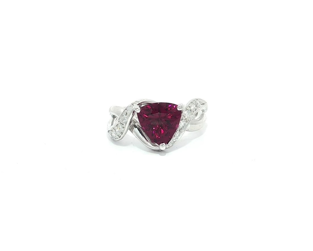 Platinum 2.26ctw Magenta Tourmaline Diamond Cocktail Ring: Platinum 2.26ctw Magenta Tourmaline Diamond Cocktail Ring This stunning cocktail ring features a captivating natural trillion cut tourmaline in a rich magenta color, prong set to showcase its beauty.