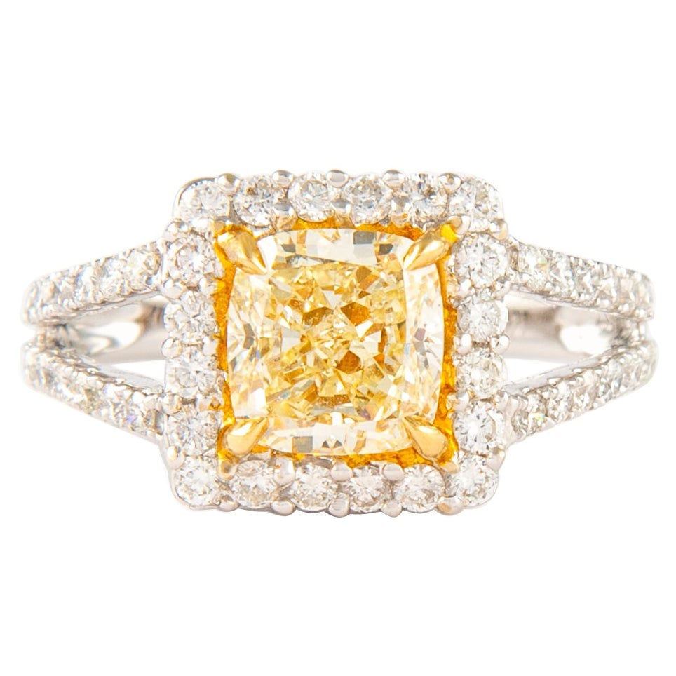 2.72ct Fancy Yellow Cushion Diamond Halo Ring 18k Gold EGL Certified: 2.72ct Fancy Yellow Cushion Diamond Halo Ring 18k Gold EGL Certified This exquisite ring features a stunning 2.72ct Fancy Yellow cushion cut diamond, certified by EGL, set in a beautiful two-tone 18k