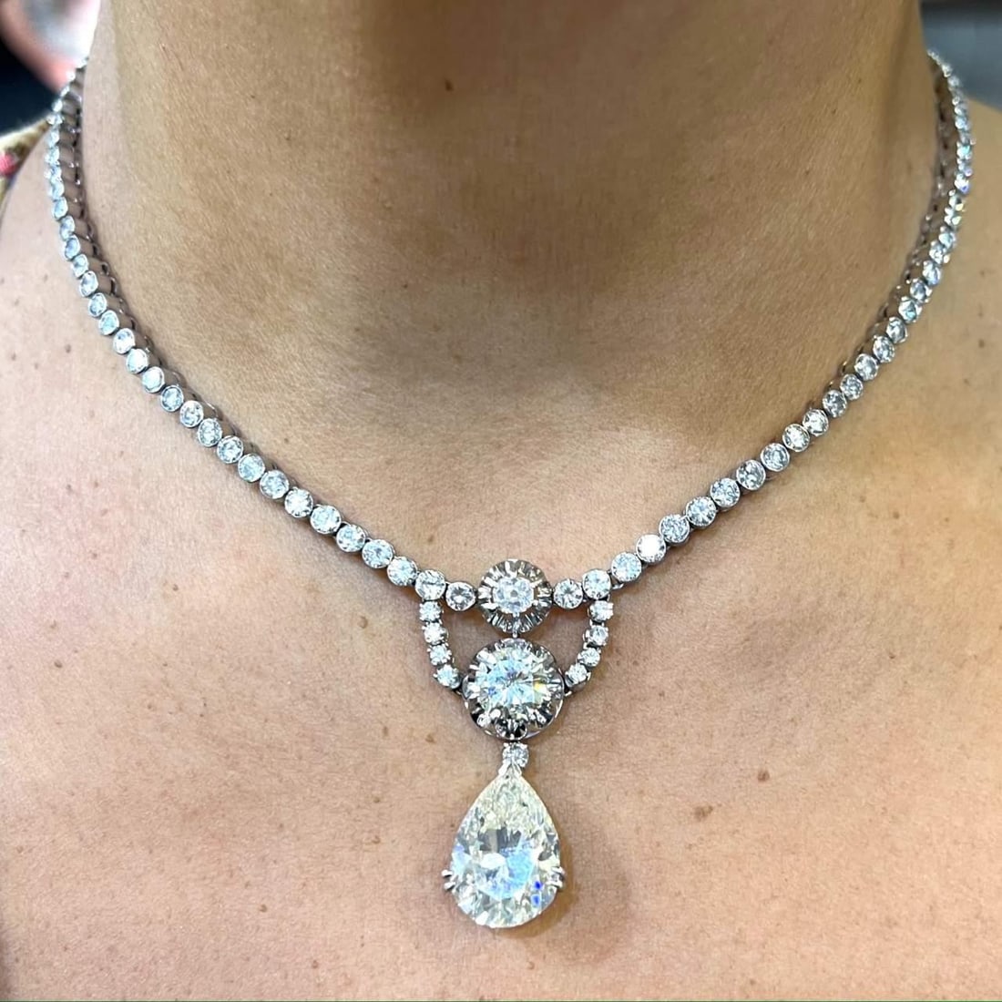 GIA Certified Art Deco Platinum Diamond Necklace 11.82 Ct Pear-Shaped: GIA Certified Art Deco Platinum Diamond Necklace 11.82 Ct Pear-Shaped This stunning Art Deco Platinum Necklace is a true masterpiece, featuring a GIA Certified 11.82 Ct. pear-shaped diamond at its cen
