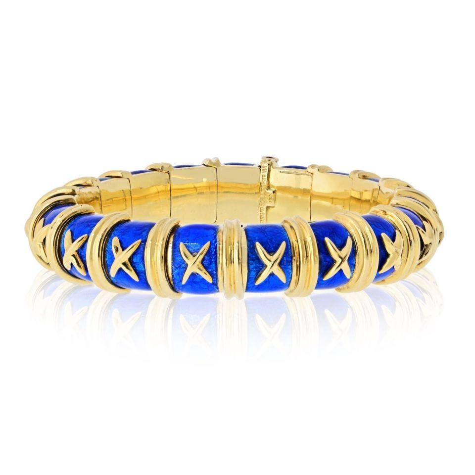 Schlumberger Croisillon Bangle in 18K Gold with Blue Enamel by Tiffany: Schlumberger Croisillon Bangle in 18K Gold with Blue Enamel by Tiffany This Tiffany & Co. Schlumberger Croisillon bangle bracelet is crafted from 18K yellow gold and features a vibrant azure blue enam