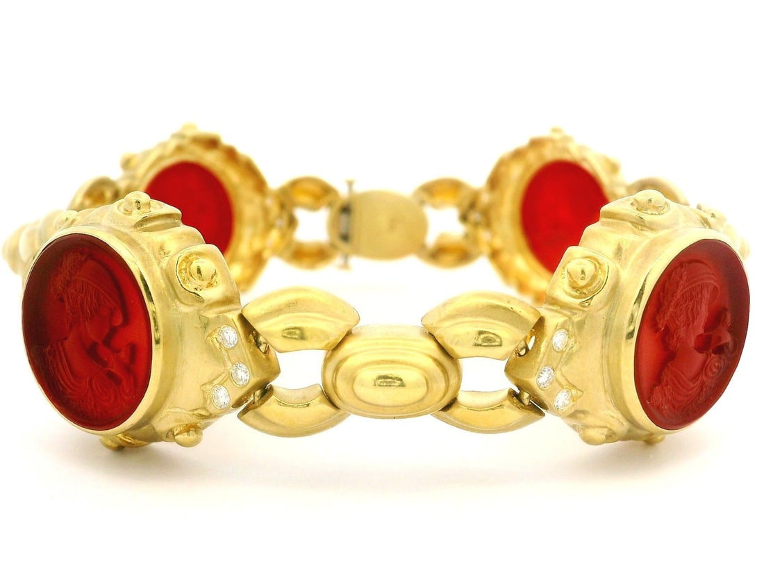 Vintage 18K Gold Open Link Bracelet with Carnelian and Diamonds: Vintage 18K Gold Open Link Bracelet with Carnelian and Diamonds This elegant vintage bracelet showcases a stunning combination of 18k yellow gold, intaglio carved carnelian, and sparkling diamonds.