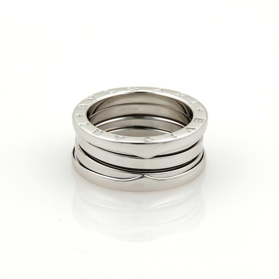 Bulgari B Zero.1 Spiral 18k White Gold 8mm Ring Size 52: Bulgari B Zero.1 Spiral 18k White Gold 8mm Ring Size 52 This exquisite Bulgari B Zero.1 Spiral ring is a stunning piece from the renowned Bvlgari collection, skillfully crafted from 18k white gold. Th