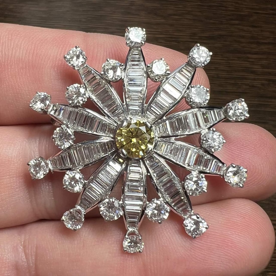 Art Deco Platinum Brooch with GIA Certified 0.81 Ct Fancy Yellow Diamond: Art Deco Platinum Brooch with GIA Certified 0.81 Ct Fancy Yellow Diamond This exquisite Art Deco brooch is crafted in platinum and features a stunning GIA Certified Fancy Yellow Diamond at its center,