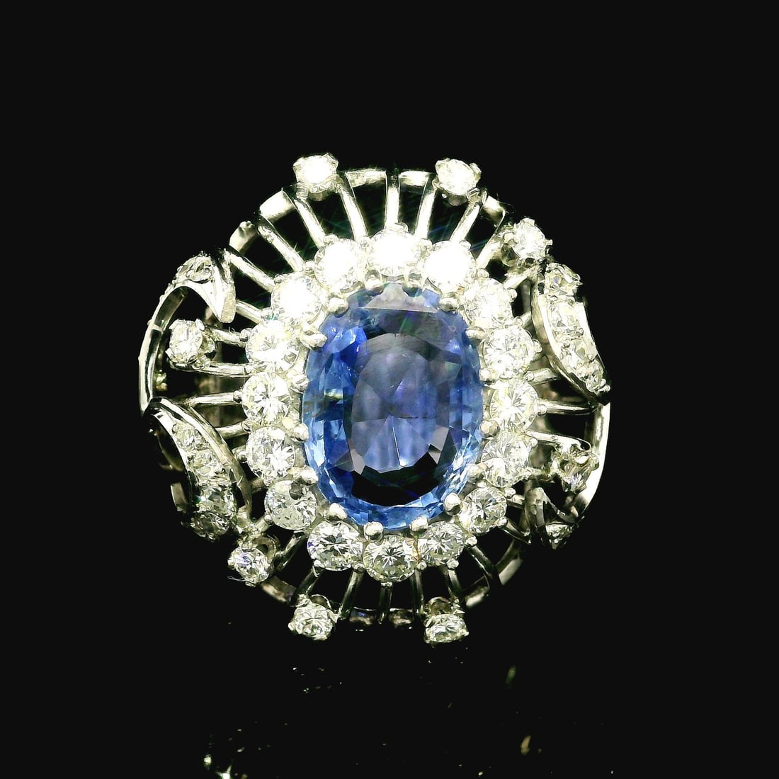 Vintage GIA Certified 5.50ct No Heat Blue Sapphire Diamond Bombe Ring: Vintage GIA Certified 5.50ct No Heat Blue Sapphire Diamond Bombe Ring This exquisite vintage ring showcases a stunning 4.0ct natural genuine sapphire, beautifully cut in an oval shape and featuring a