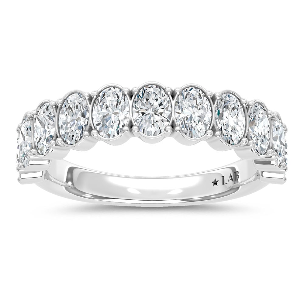 14K White Gold Lab Grown Diamond 4 Ct.Tw. Oval Shape Wedding Band: 14K White Gold Lab Grown Diamond 4 Ct.Tw. Oval Shape Wedding Band This exquisite 14K White Gold Wedding Band, set with 4 Ct.Tw. of Oval Lab Grown Diamonds, is the perfect combination of elegance and g