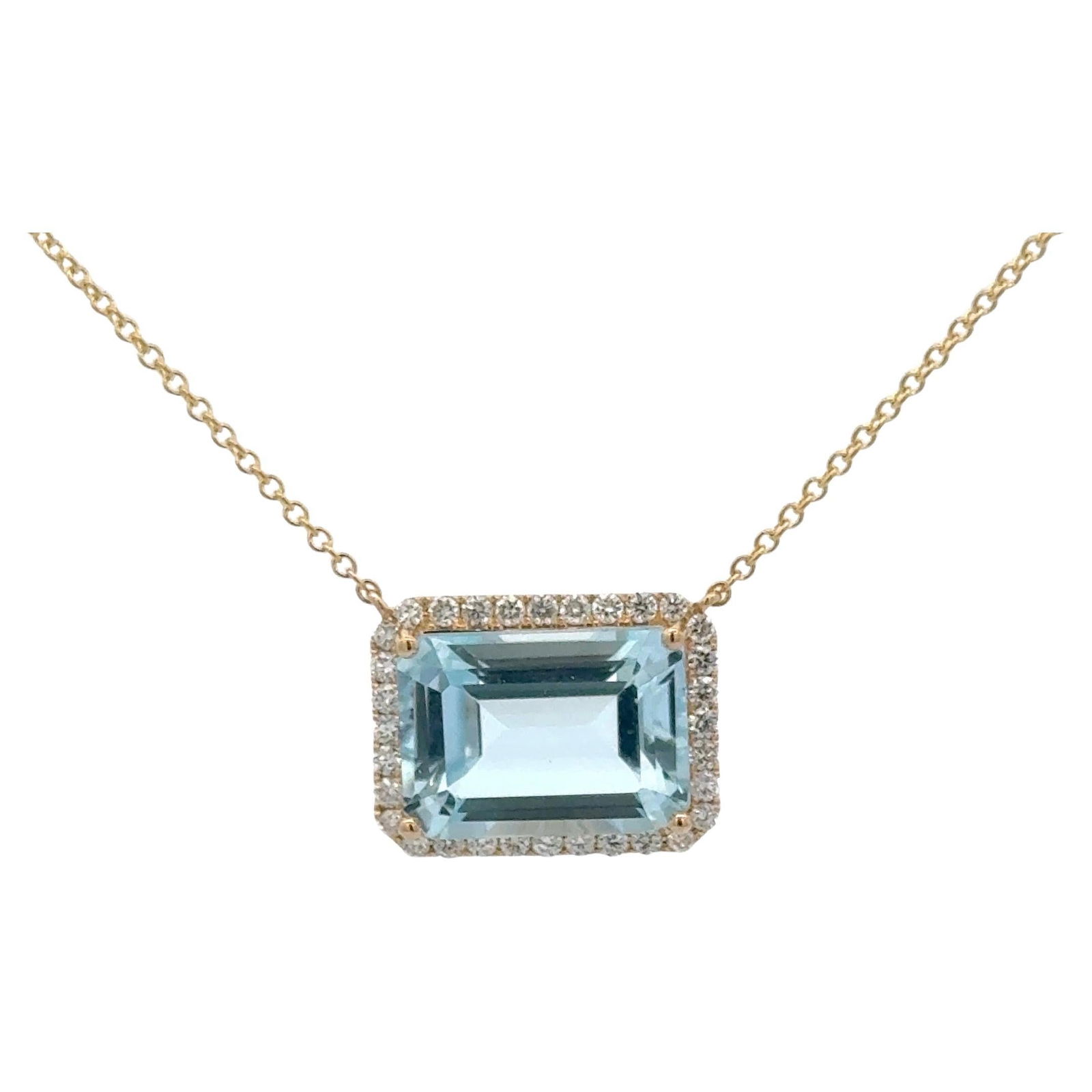 Harbor Diamonds Emerald Cut Sky Blue Topaz Pendant with Diamond Halo 14K Gold: Harbor Diamonds Emerald Cut Sky Blue Topaz Pendant with Diamond Halo 14K Gold This exquisite pendant showcases a stunning Emerald Cut Sky Blue Topaz weighing 9.72 carats, elegantly surrounded by a hal