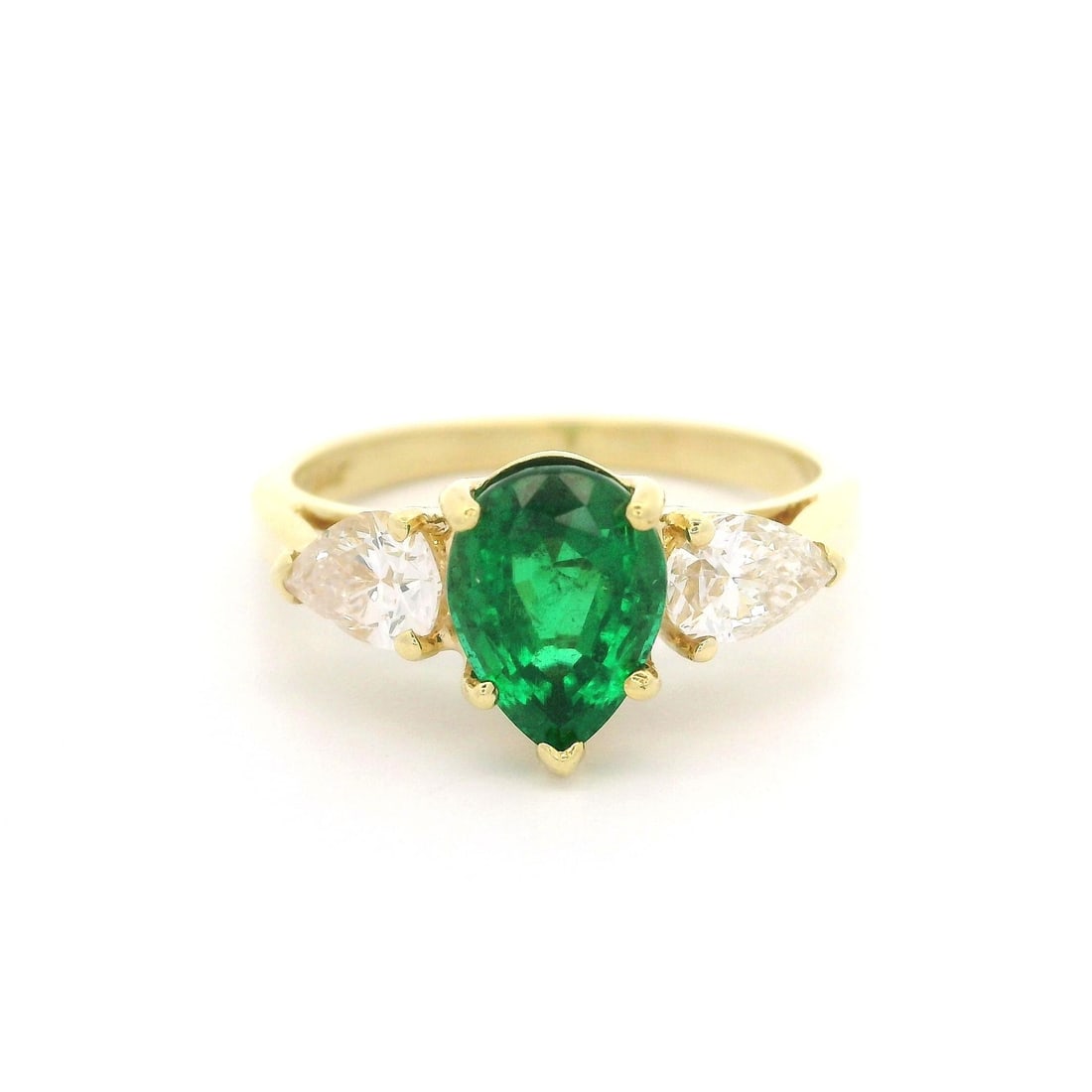 Elegant 18k Yellow Gold GIA 2.10ct Pear Cut Emerald Diamond Cocktail Ring: Elegant 18k Yellow Gold GIA 2.10ct Pear Cut Emerald Diamond Cocktail Ring This exquisite cocktail ring showcases a stunning natural pear cut emerald, prong set in solid 18k yellow gold, complemented b