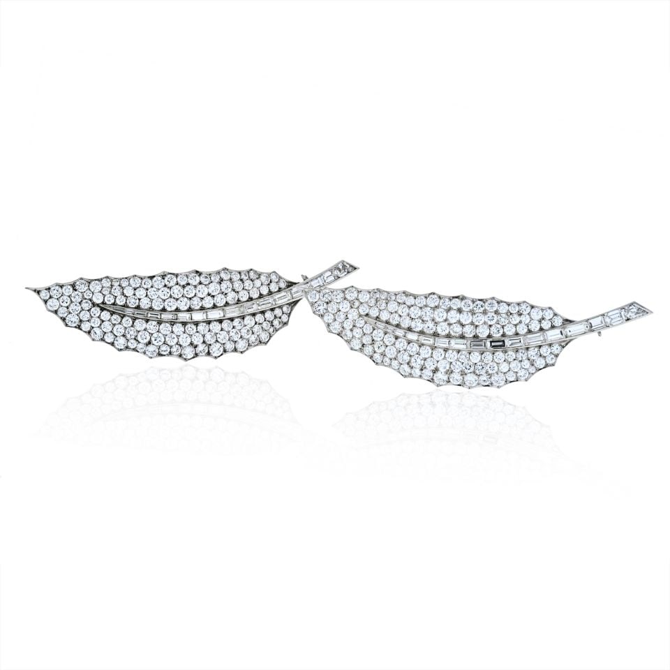 David Webb Platinum 40 Carat Diamond Leaf Brooch Pair: David Webb Platinum 40 Carat Diamond Leaf Brooch Pair This exquisite pair of brooches by David Webb showcases a stunning design inspired by nature, featuring intricate platinum and 18k gold leaf motif