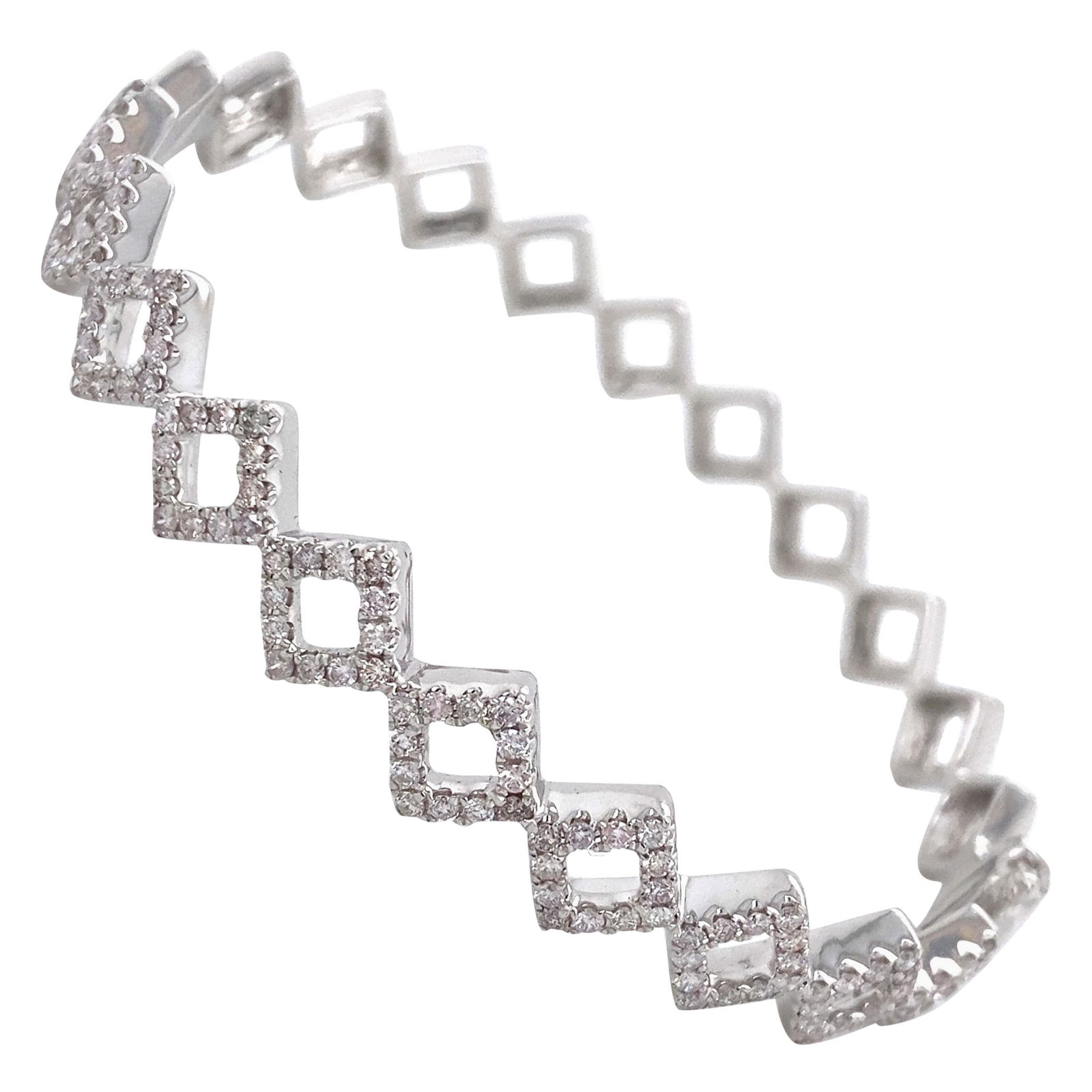 1.20ct Diamond Bangle Bracelet 18k White Gold Contemporary: 1.20ct Diamond Bangle Bracelet 18k White Gold Contemporary This exquisite 1.20 ct Diamond Bangle Bracelet is crafted from 18k white gold, showcasing a contemporary design. The bracelet features 120 ro