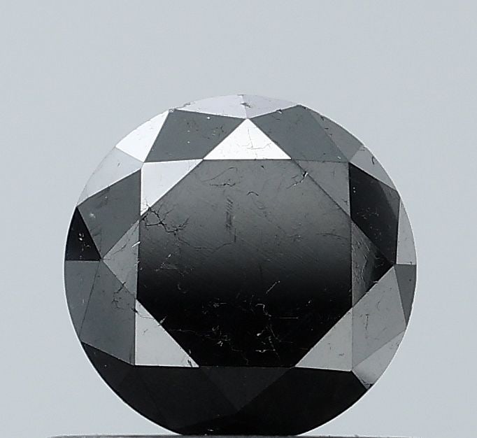 Loose Diamond - ROUND 0.56ct Fancy Black VS2: Loose Diamond - ROUND 0.56ct Fancy Black VS2 Source: Natural Shape: ROUND Carats: 0.56 Color: Fancy Black Certification: NONE Video: