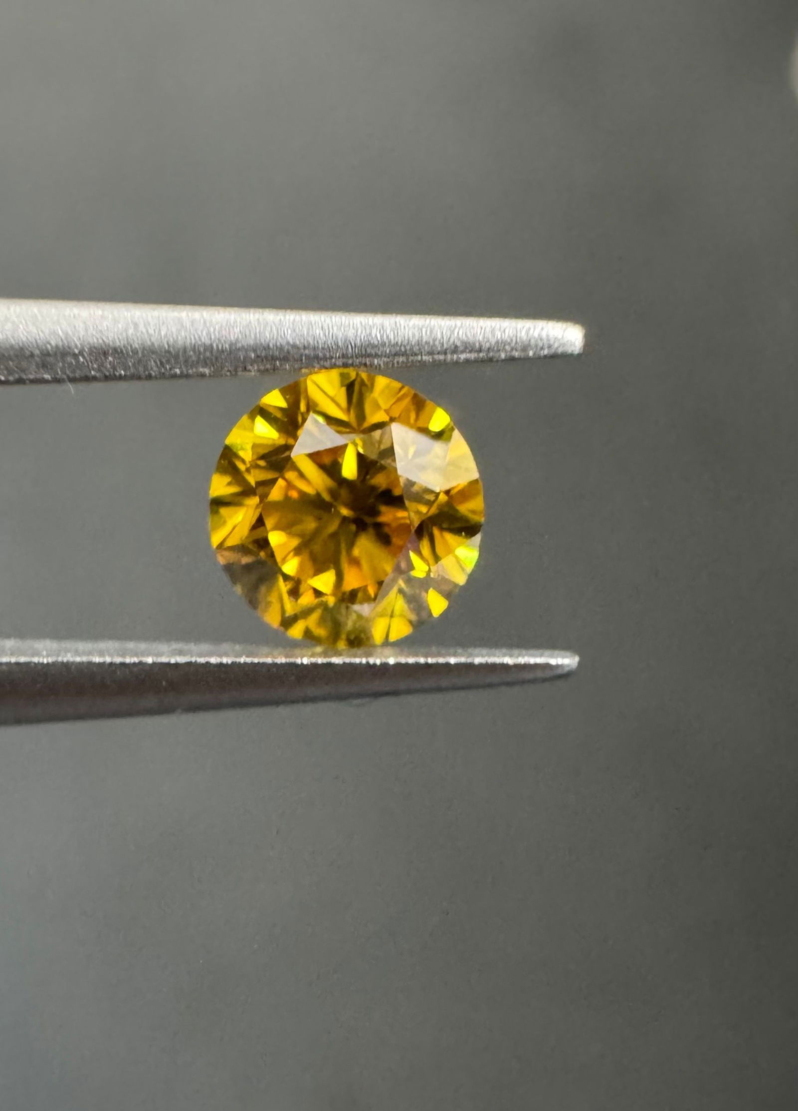 Loose Diamond - ROUND 0.38ct Fancy Vivid Orangey Yellow VS1: Loose Diamond - ROUND 0.38ct Fancy Vivid Orangey Yellow VS1 Source: Natural Shape: ROUND Carats: 0.38 Color: Fancy Vivid Orangey Yellow Certification: GIA PLEASE NOTE: Framed, Large, or heavy items do