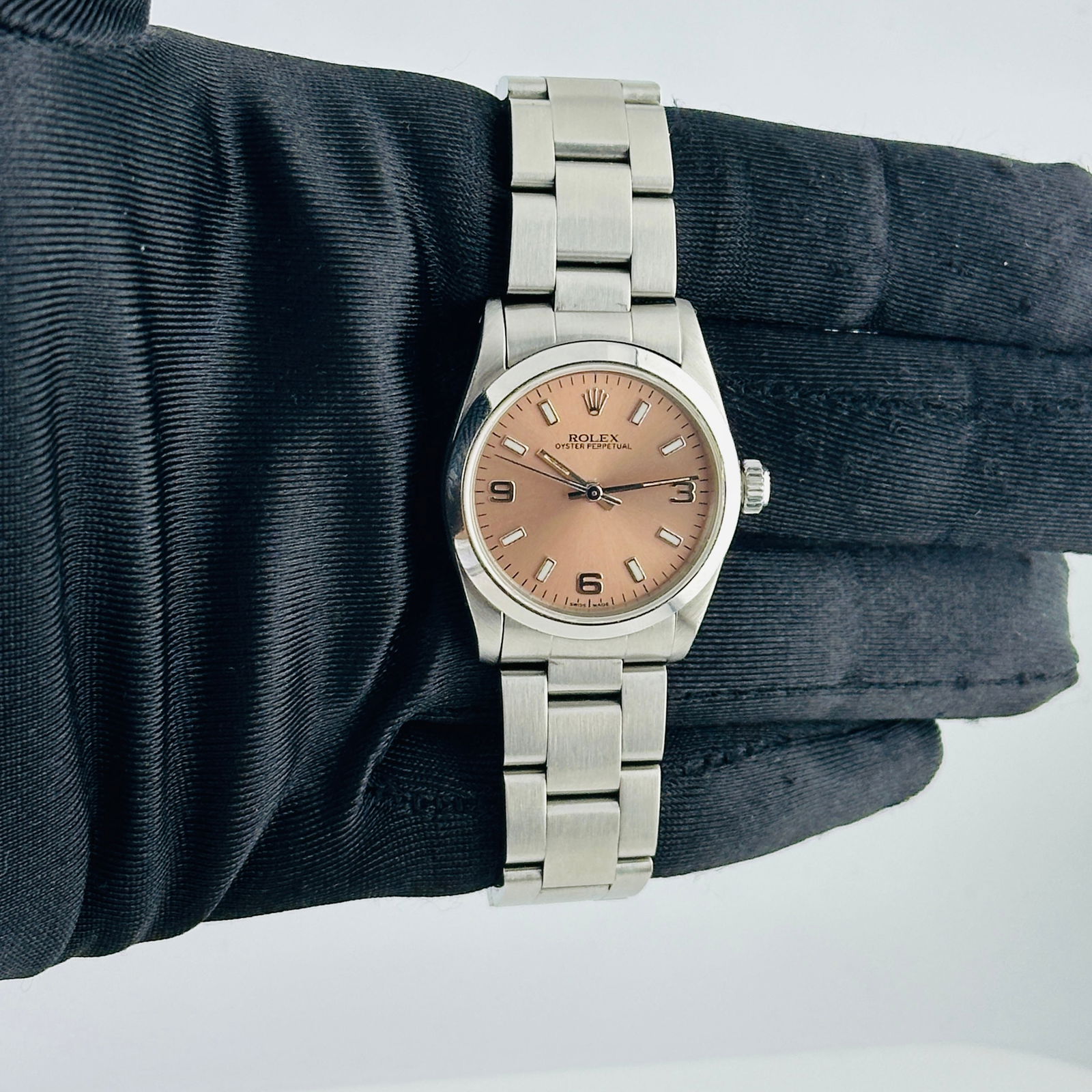 Ladies Rolex Oyster Perpetual Ref 67480 Salmon Dial with Oyster Bracelet: Ladies Rolex Oyster Perpetual Ref 67480 Salmon Dial with Oyster Bracelet This ladies Rolex Oyster Perpetual features an Aftermarket lavender dial and a smooth bezel, complemented by an Oyster bracelet