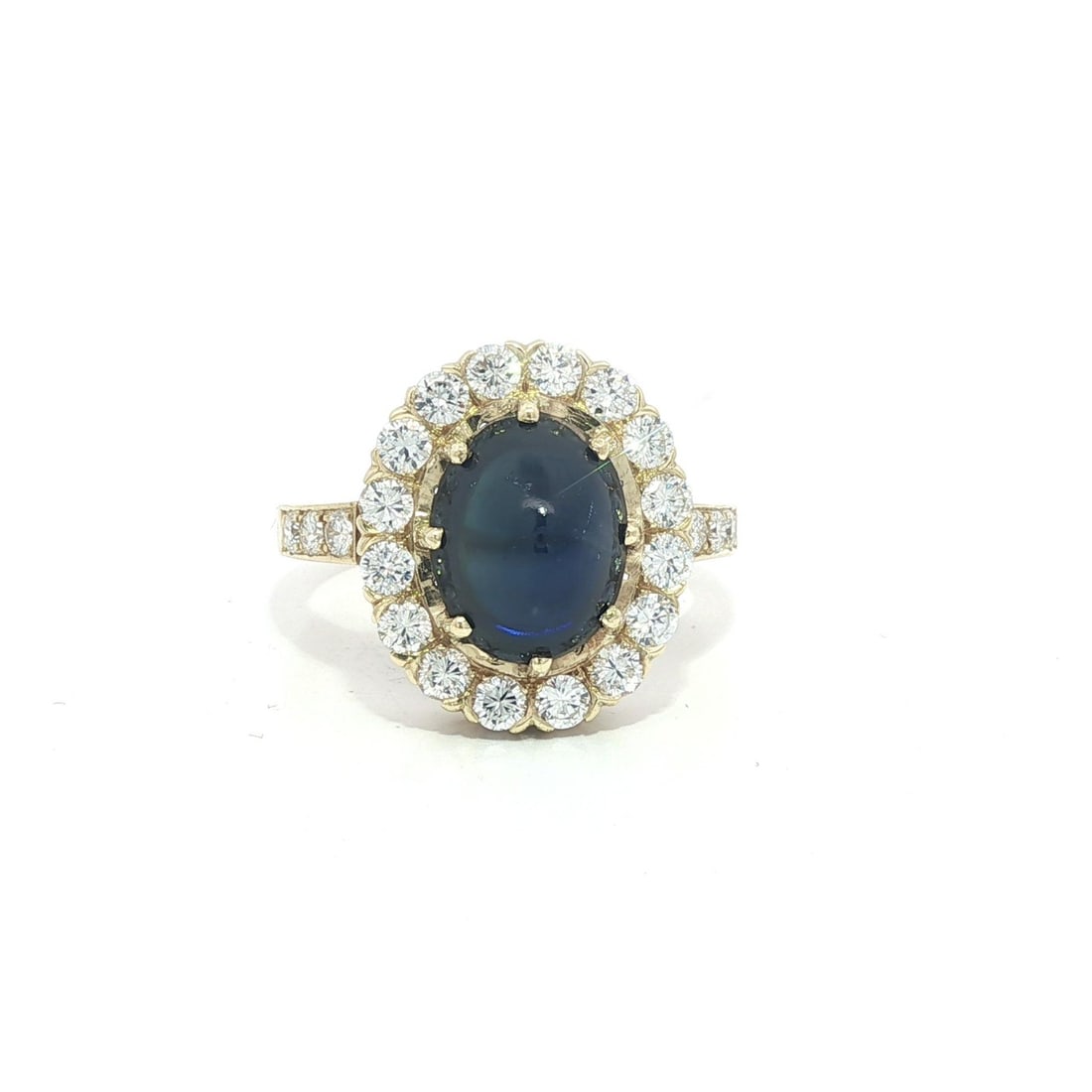 Vintage 14k Yellow Gold GIA No Heat Cabochon Sapphire Diamond Cocktail Ring: Vintage 14k Yellow Gold GIA No Heat Cabochon Sapphire Diamond Cocktail Ring Discover this exquisite vintage cocktail ring featuring a stunning natural blue sapphire and sparkling diamonds. At its cent
